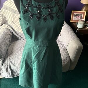 Elegant Green Dress with Black Embellishments